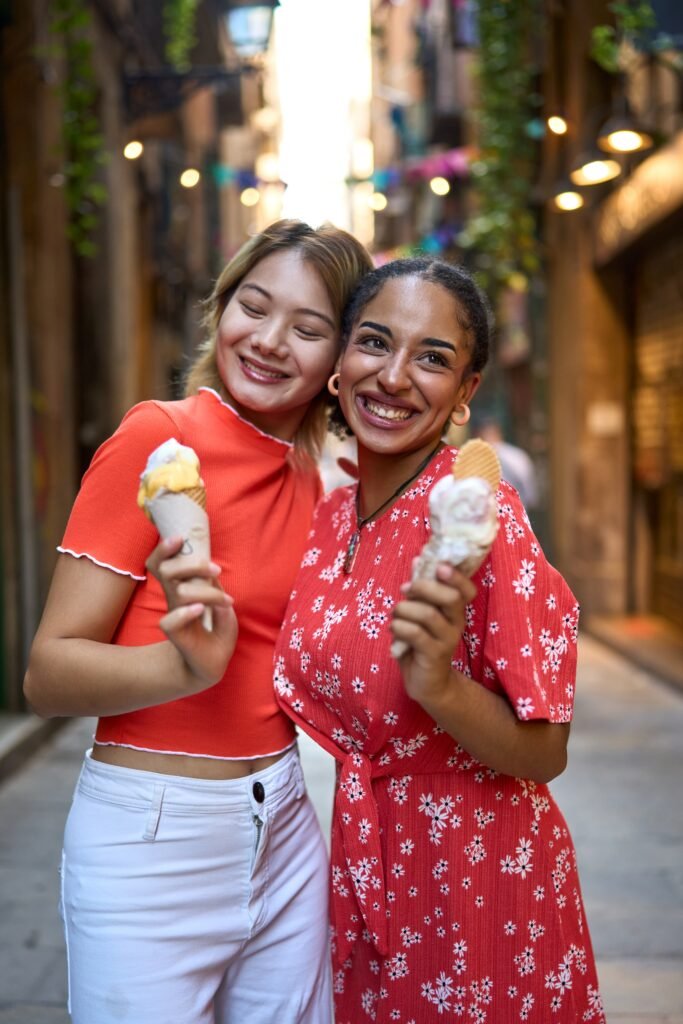 Happy lesbian couple enjoying ice cream